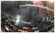 3 injured as Serbian lawmakers throw smoke grenades, tear gas in parliament