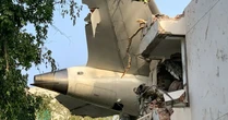 India air crash: Grieving families demand full-bodied remains as officials return only fragments