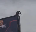 Tension in Kano as man remains hanging in tall billboard, attempts taking own life 