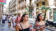 Key to solving loneliness, pollution might be giving up cars, hanging out in the street. It's working in Barcelona