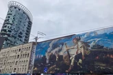 Пошкоджену обстрілами будівлю заводу «Артем» на Лук’янівці закрито полотном (фото)