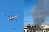Пожежа на Почайній внаслідок обстрілу: вогонь на господарському ринку гасять вертольоти (відео)