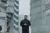 Командир РДК Капустін звернувся до росіян на тлі зруйнованої багатоповерхівки у Києві
