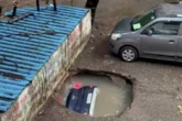 Страшне відео з Мумбаї: асфальт за секунди поглинув машину на парковц