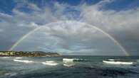 Gran arco iris en La Fosca en pleno temporal