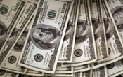 El dólar cae a la espera de las decisiones de los bancos centrales