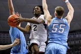 No. 1 UConn men seek rare road win over ranked foe
