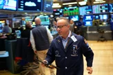 Wall Street gains ground amid steady flow of earnings reports, upbeat economic updates