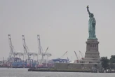 Trump’s new tariffs go into effect as US economy shows signs of strain