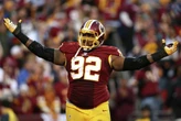Former NFL player banned from CT high school's football-related activities