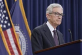 Fed leaves key rate unchanged as it awaits the impact of tariffs and Trump again scolds Powell