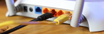 Désactiver ce bouton sur ma box internet m'a permis de décupler le signal du Wi-Fi chez moi