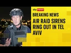 Smoke rises from Tel Aviv as 'dozens of missiles' fired at Israel in retaliatory strikes