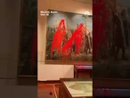 Climate activists vandalize Christopher Columbus painting on Spain's National Day