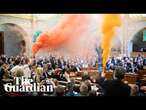 Smoke bombs ignited as Hungarian parliament passes law banning Pride events