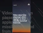 Video taken from passenger plane appears to show missiles launched from Iran