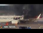 American Airlines plane catches fire at Denver International Airport