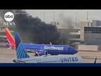 American Airlines flight catches fire at Denver airport