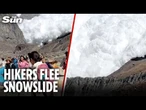 Terrifying moment MEGA avalanche thunders straight for hiking camp
