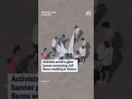 Activists unroll a giant banner protesting Jeff Bezos wedding in Venice