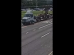 Semitruck hauling a forklift sends a utility pole flying