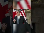 Bizarre moment Trump touches Starmer's back during press conference