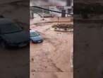 Cars dragged by raging floodwaters in Gran Canaria