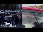 Footage shows men attacking cars and shouting racist abuse in Belfast