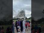 Spectators watch controlled building implosion in Louisiana