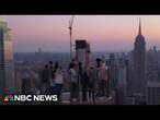 NBC News hosts ride Skylift, an attraction that takes you above Rockefeller Center