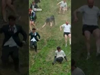 Thrill-seekers roll down Cooper's Hill in traditional British cheese rolling race
