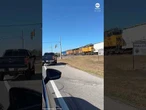 Train slams into semi-trailer stuck on tracks