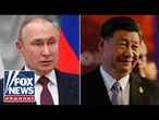 Putin, Xi Jinping pledge to stand together against US