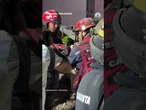 Firefighters give water to rescued dog in Caracas