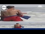 Lifeguard battles high surf to rescue swimmer