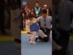 Jackie Slam! Little girl keeps falling over while trying to taekwondo kick opponent