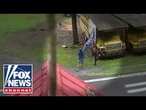 CAUGHT ON TAPE: Man tears down Trump banner, fires shots at home