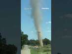 Enormous dust devil suddenly appears and spirals in the air right in front of a driver in Tennessee