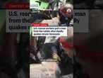 U.S. rescue workers pull a man from the rubble after deadly quakes struck Venezuela