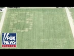 '86 47' VANDALIZED on grass at National Mall