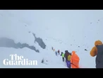 Eyewitness video captures hikers wading through snow after blizzard near Everest