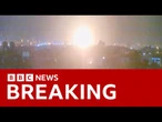 Israel announces strikes on Iran's nuclear sites as blasts heard across country | BBC News