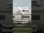 Plane crashes into airplane hangar roof
