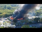 Drone footage shows church on fire after shooting in Michigan