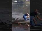 Volunteers clean up lake after deadly floods