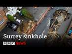 Huge sinkhole in Surrey swallows up more of street | BBC News