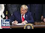 Trump signs executive orders from Oval Office