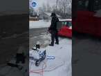 Man gets rid of snow with a flamethrower