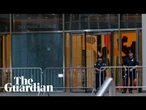 Bullet holes in Manhattan skyscraper after shooting kills four people