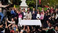 Colombia's president signs a labor overhaul into law after 2 failed attempts
